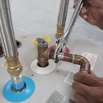 soldering a water heater pipe and tightening threaded connection