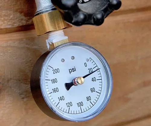 use a gauge to measure water pressure