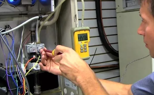 HVAC tech checking gas control valve - how to know if furnace gas valve is faulty