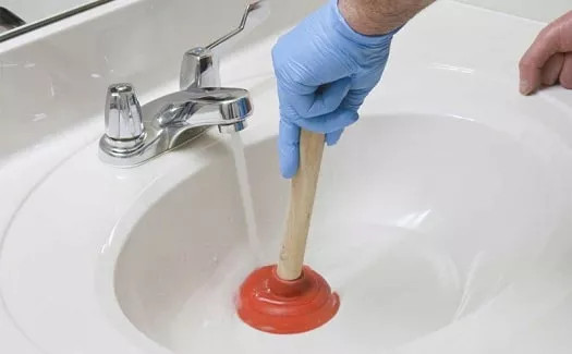 how to unclog a bathroom sink with plunger