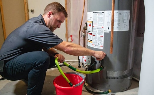 draining a water heater with a bucket
