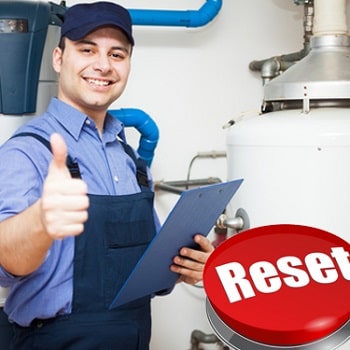plumber with a thumb up depicting how easy resetting a water heater is