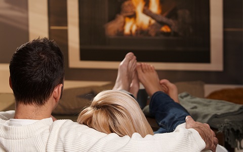 a couple enjoying a fire